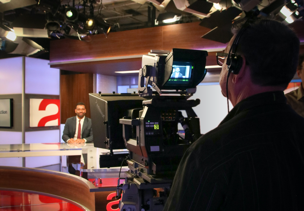 A man filming in The Agenda studio