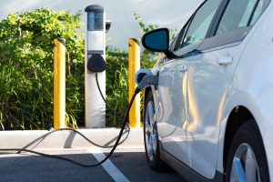 An electric vehicle at a charging station.